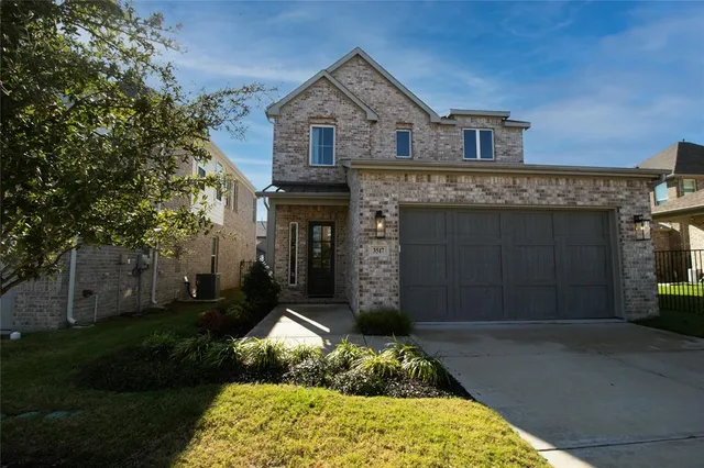 an aerial view of a house with a swimming pool