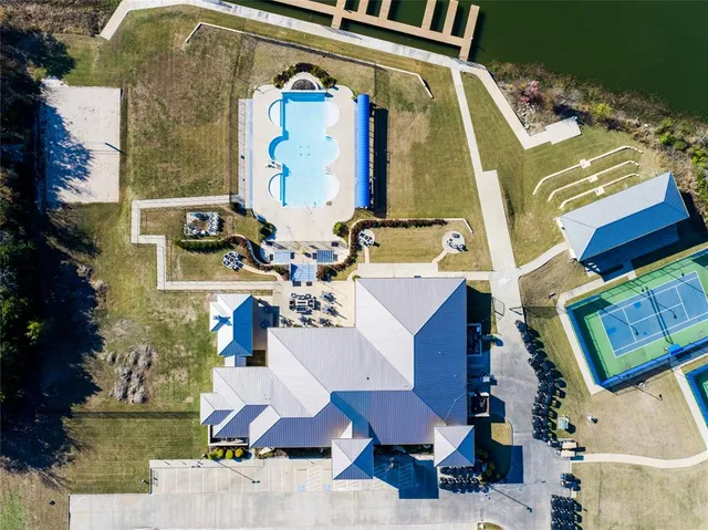 a view of swimming pool with outdoor seating and city view