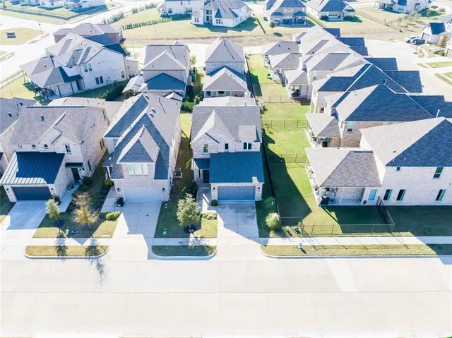a house with swimming pool in front of it