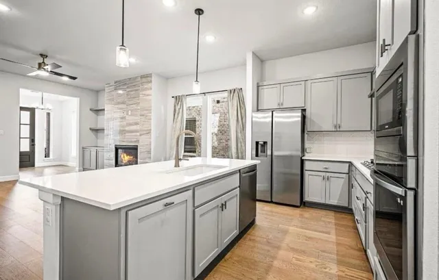 a view of a kitchen with an empty space and kitchen view