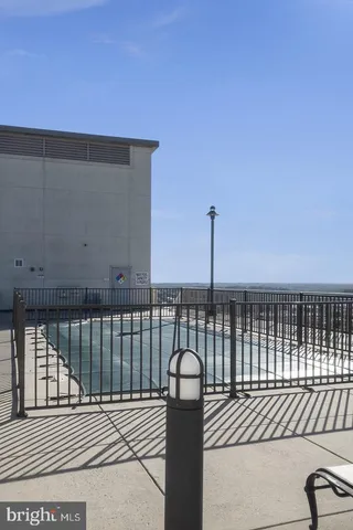 a view of a balcony with floor to ceiling window and stairs