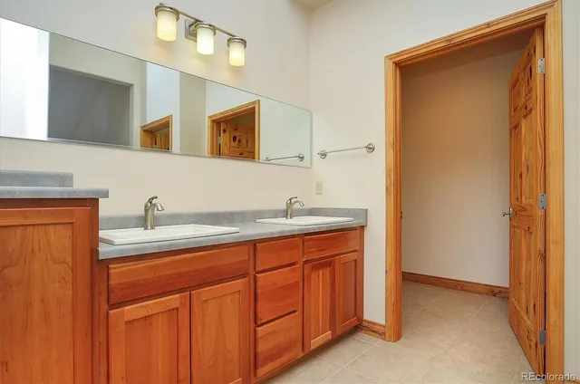 an aerial view of houses with a yard