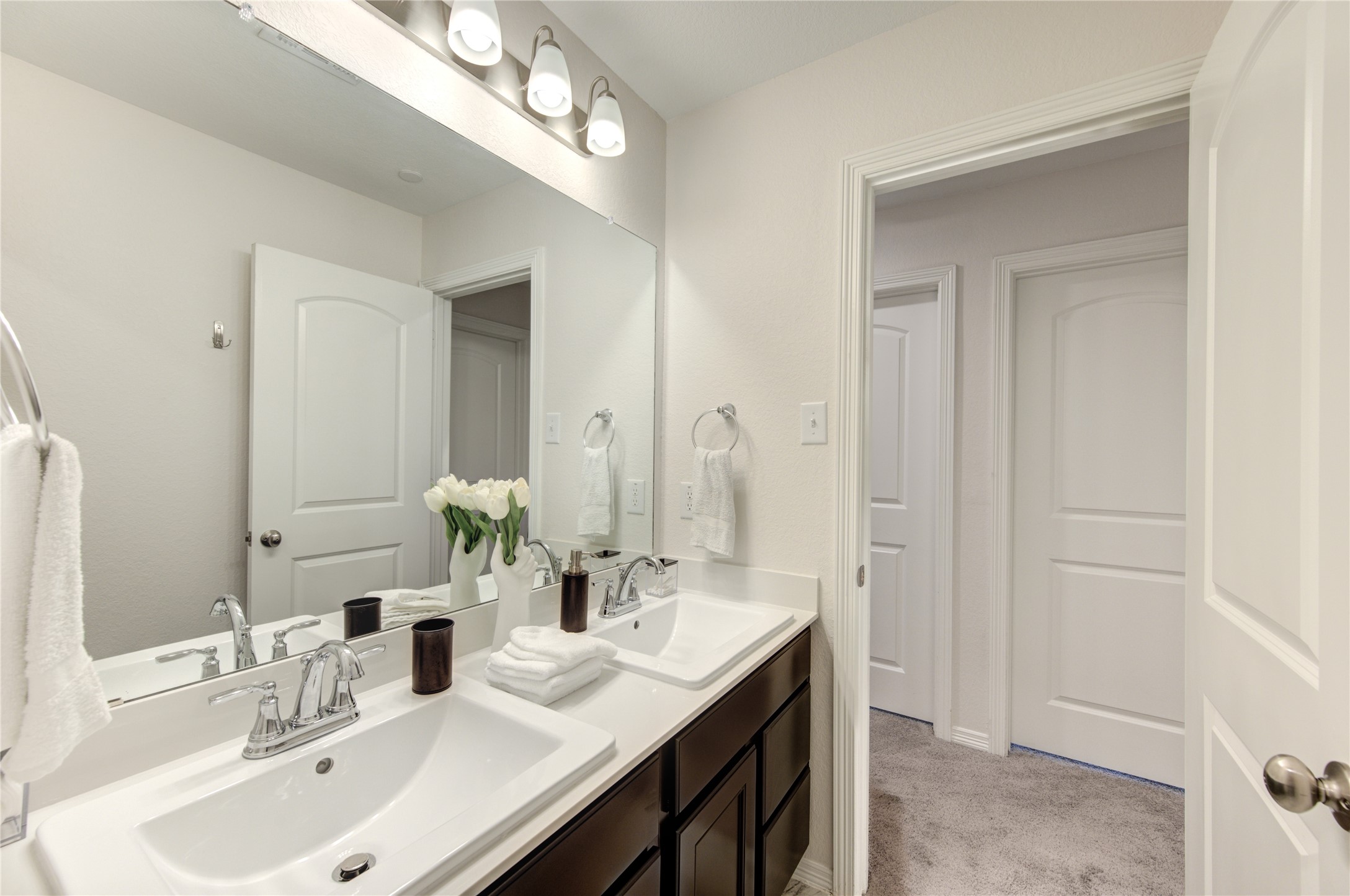 8030 Scanlan Trace Missouri City, TX 77459 - Photo 13 of 17 a bathroom with double vanity sinks and a mirror