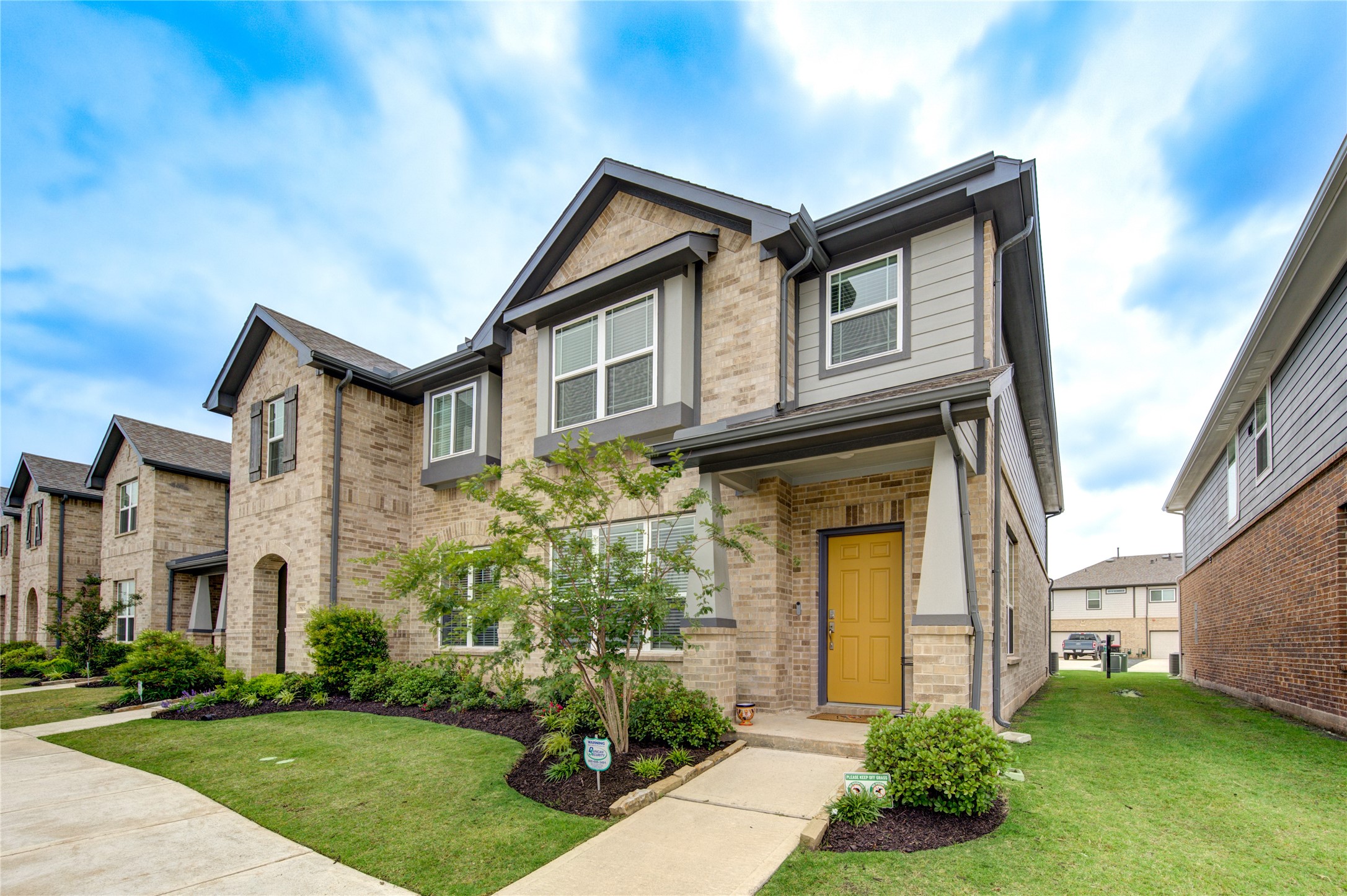 8030 Scanlan Trace Missouri City, TX 77459 - Photo 2 of 17 a front view of a house with garden