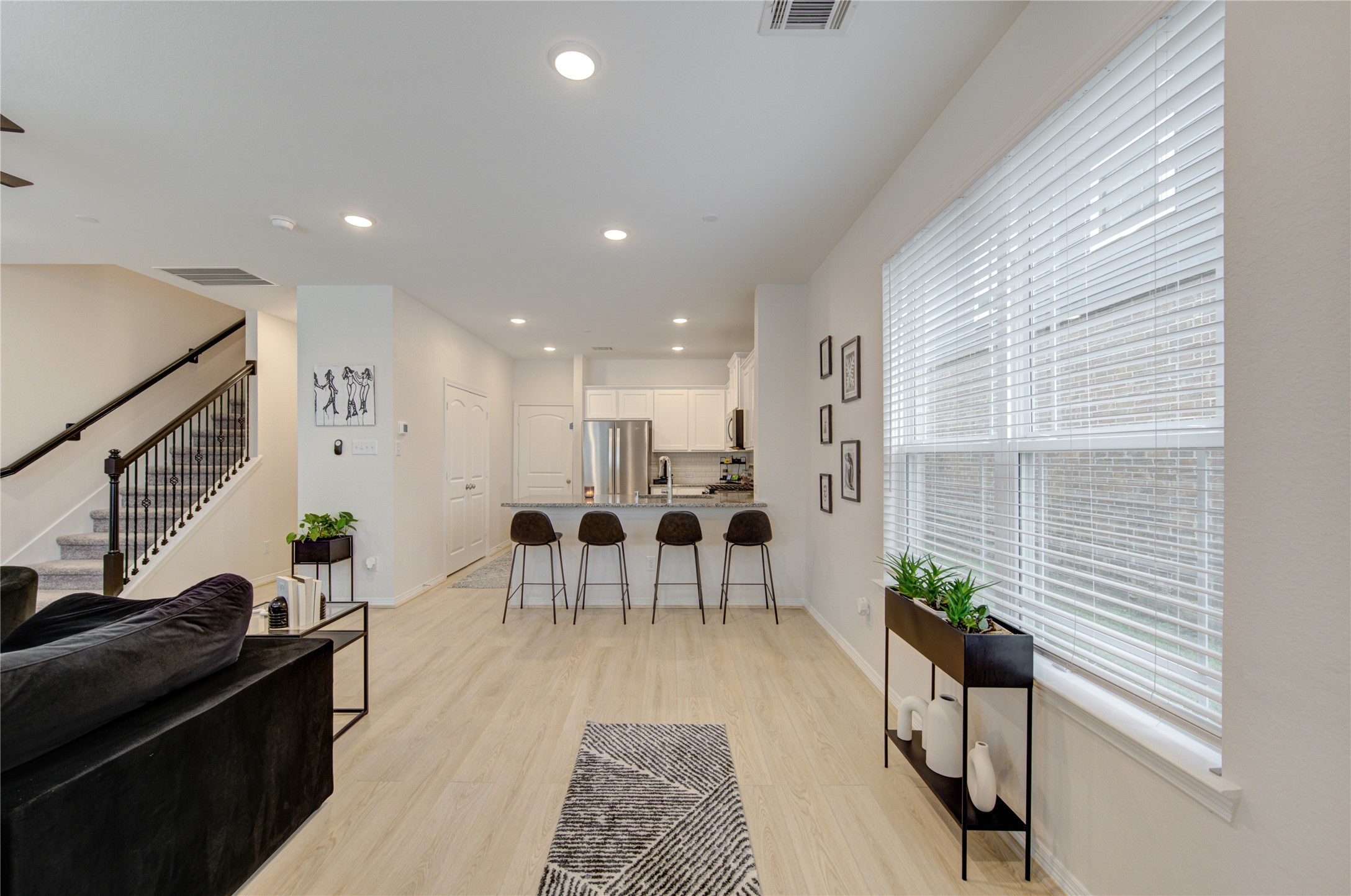 8030 Scanlan Trace Missouri City, TX 77459 - Photo 4 of 17 a living room with furniture wooden floor and a window