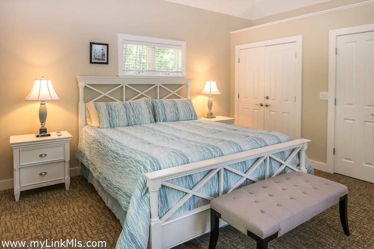 10 Codman Spring Road Edgartown, MA 02539 - Photo 12 of 30 a bedroom with a bed and a window
