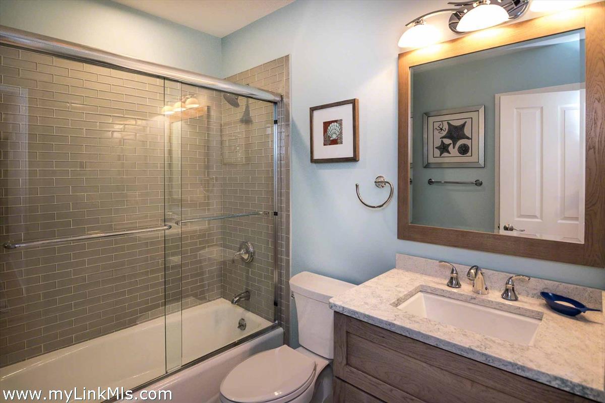 10 Codman Spring Road Edgartown, MA 02539 - Photo 17 of 30 a bathroom with a sink a toilet and shower
