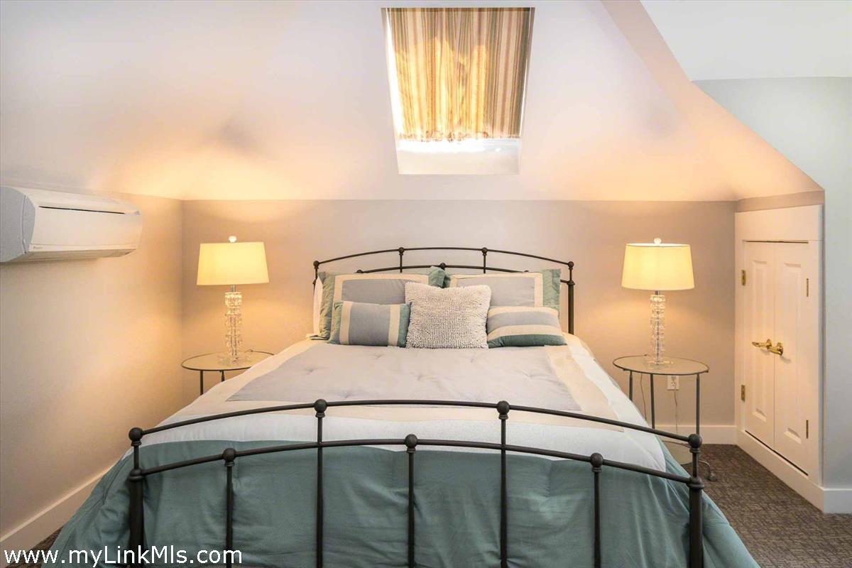 10 Codman Spring Road Edgartown, MA 02539 - Photo 21 of 30 a bedroom with a bed and a window