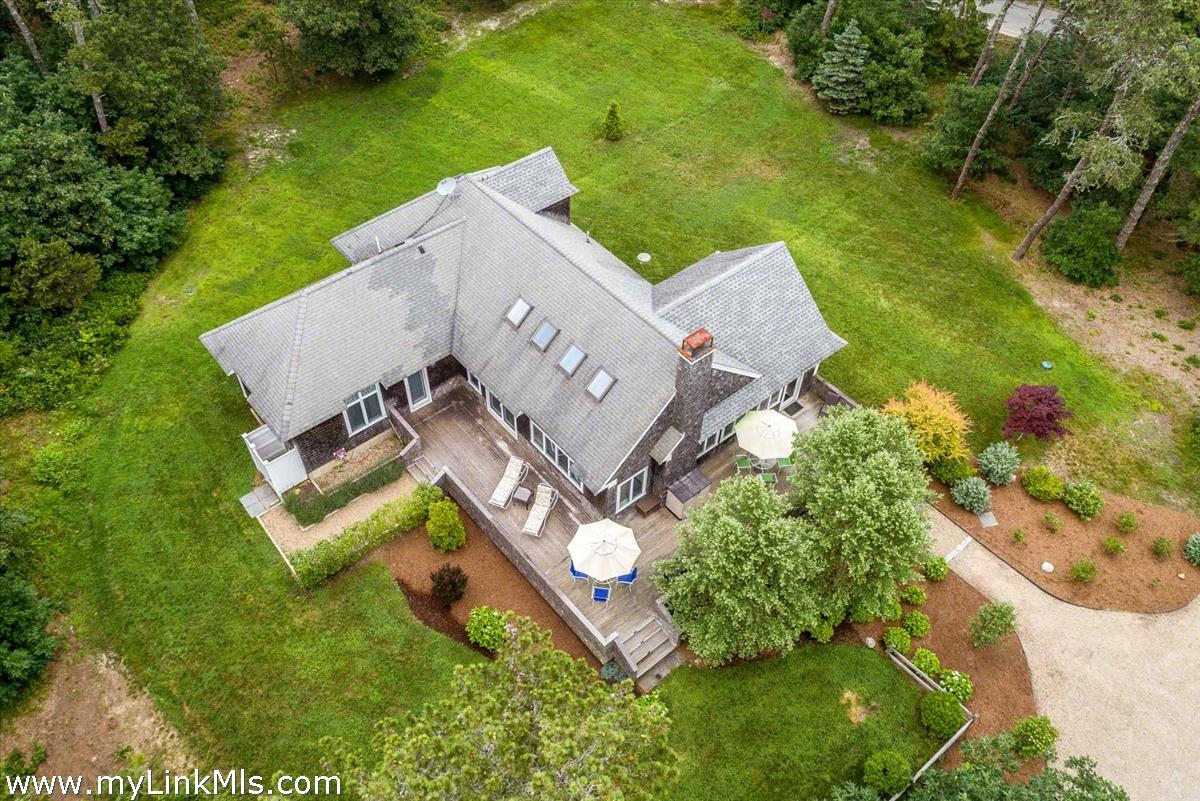 10 Codman Spring Road Edgartown, MA 02539 - Photo 26 of 30 an aerial view of a house with a garden and swimming pool