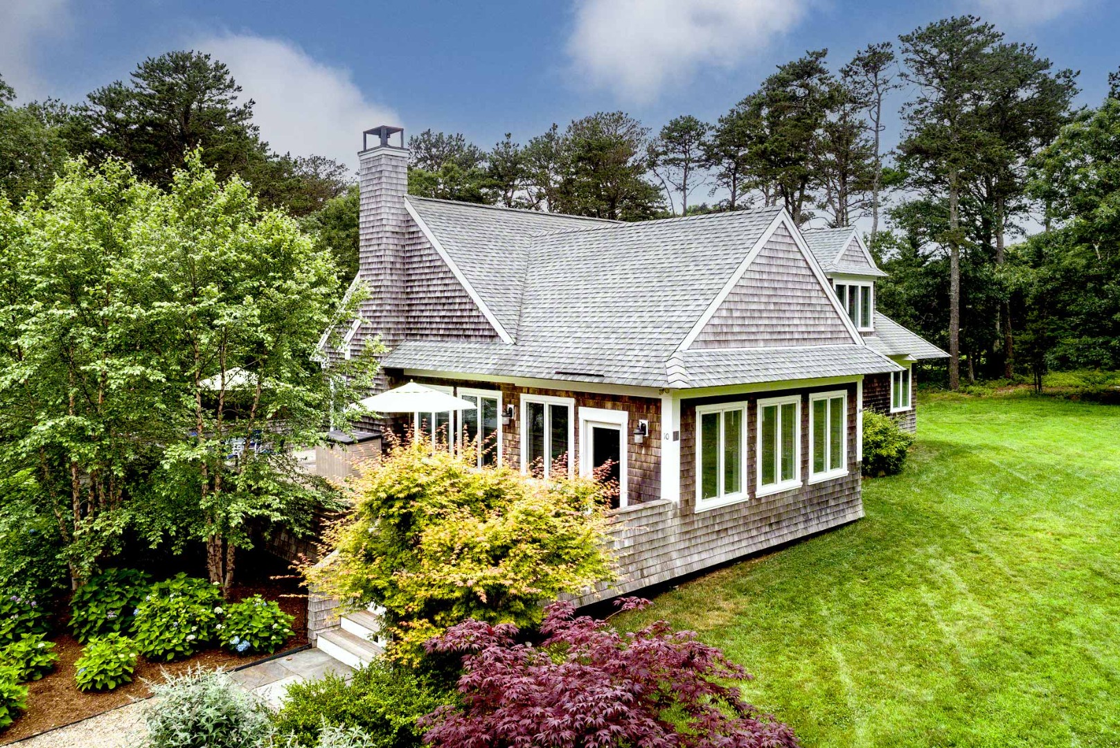 10 Codman Spring Road Edgartown, MA 02539 - Photo 27 of 30 front view of a house with a yard