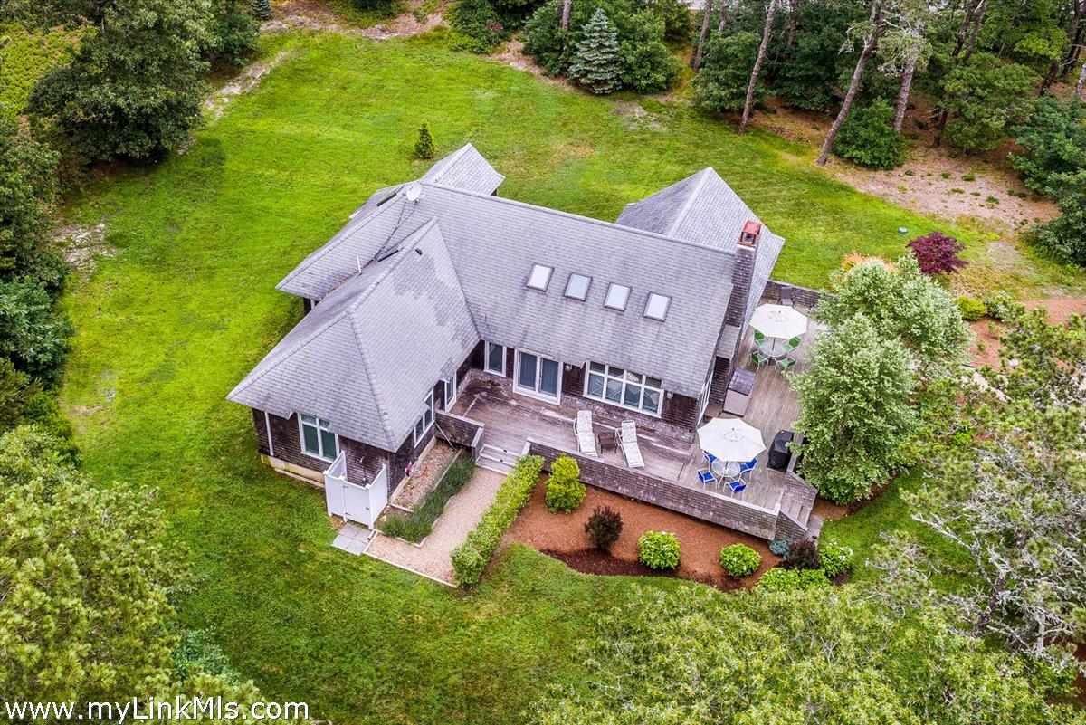 10 Codman Spring Road Edgartown, MA 02539 - Photo 3 of 30 an aerial view of a house with swimming pool and garden