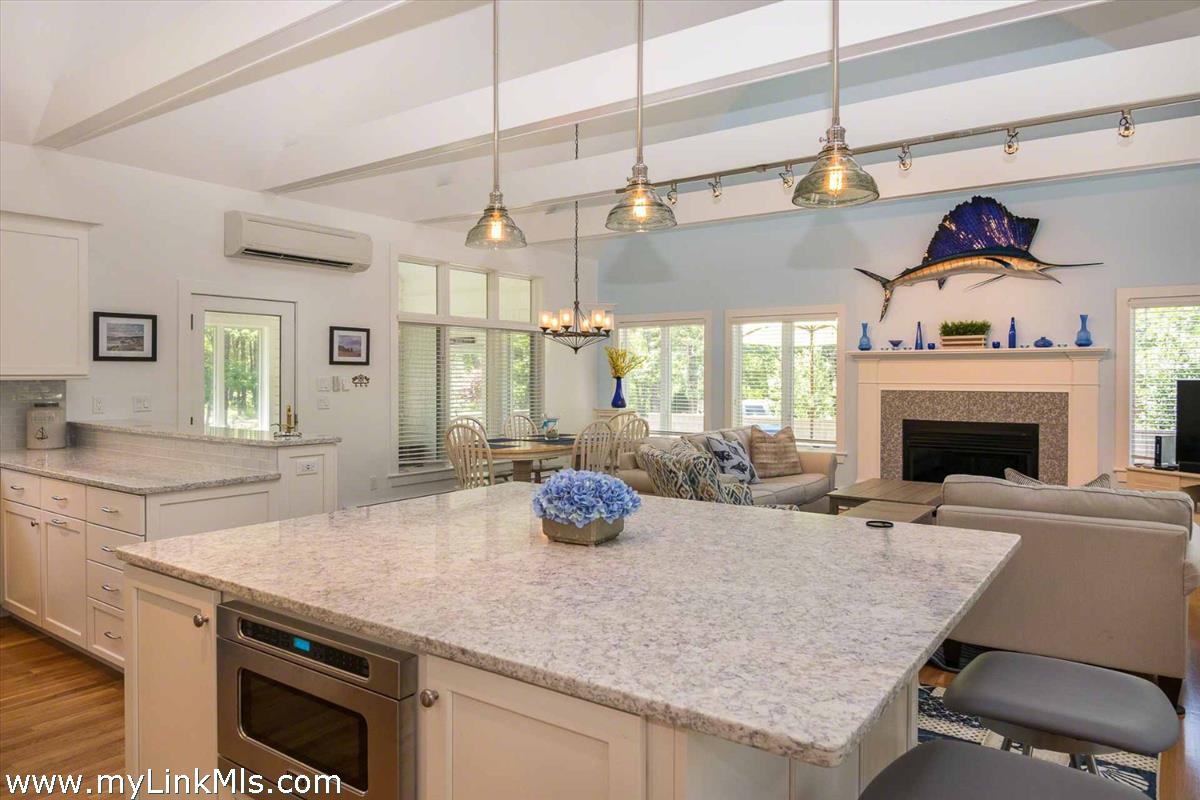 10 Codman Spring Road Edgartown, MA 02539 - Photo 8 of 30 a kitchen with a sink a counter space and a fireplace