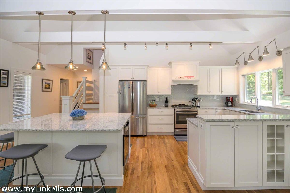 10 Codman Spring Road Edgartown, MA 02539 - Photo 9 of 30 a kitchen with stainless steel appliances granite countertop a sink and cabinets