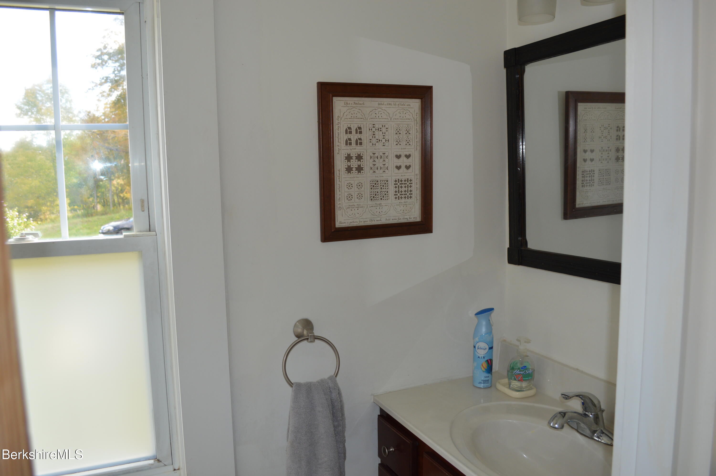 234 County Road Becket, MA 01223 - Photo 17 of 67 a bathroom with a sink and a mirror