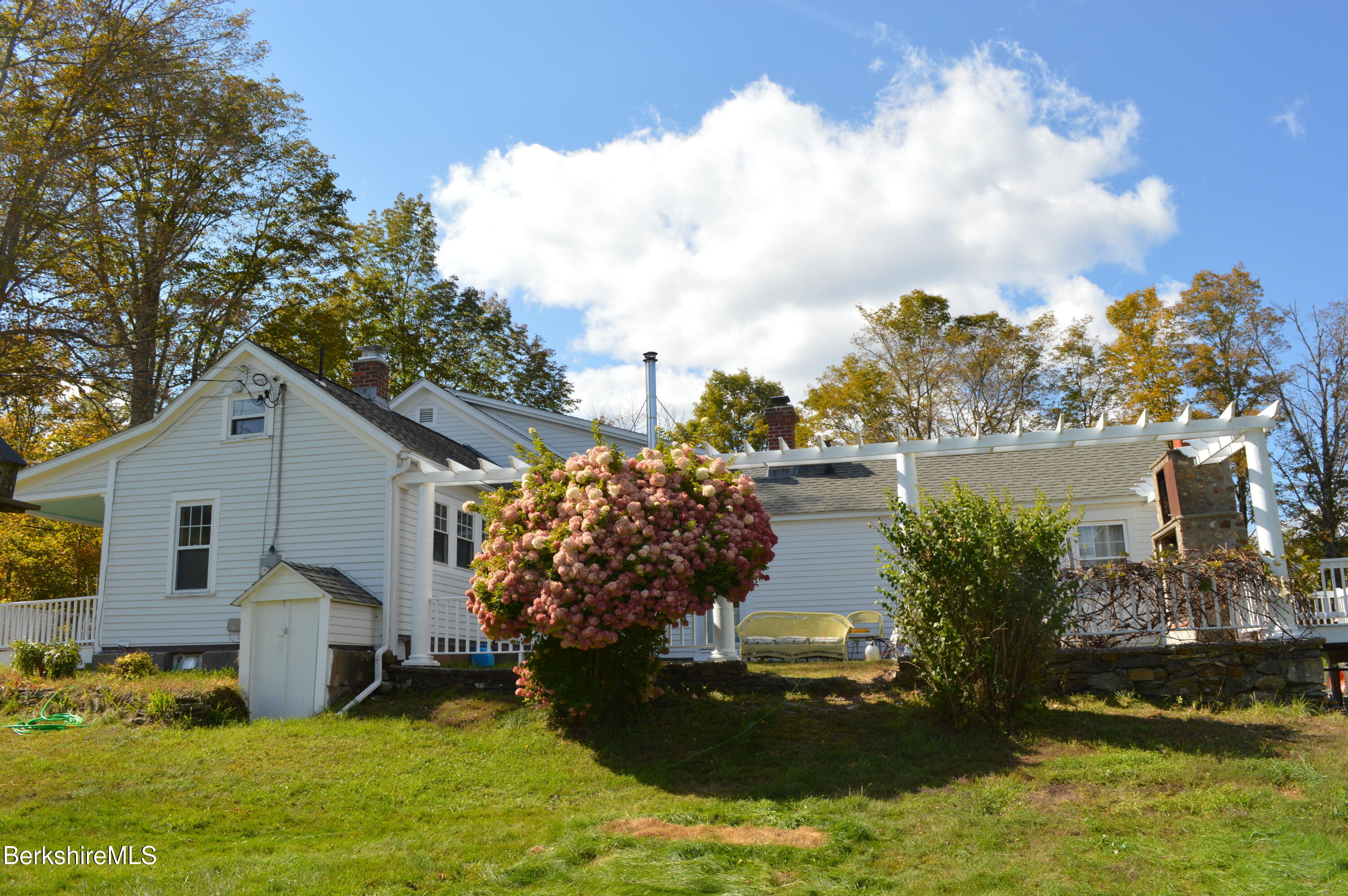 234 County Road Becket, MA 01223 - Photo 3 of 67 a view of a house with a yard and a pond