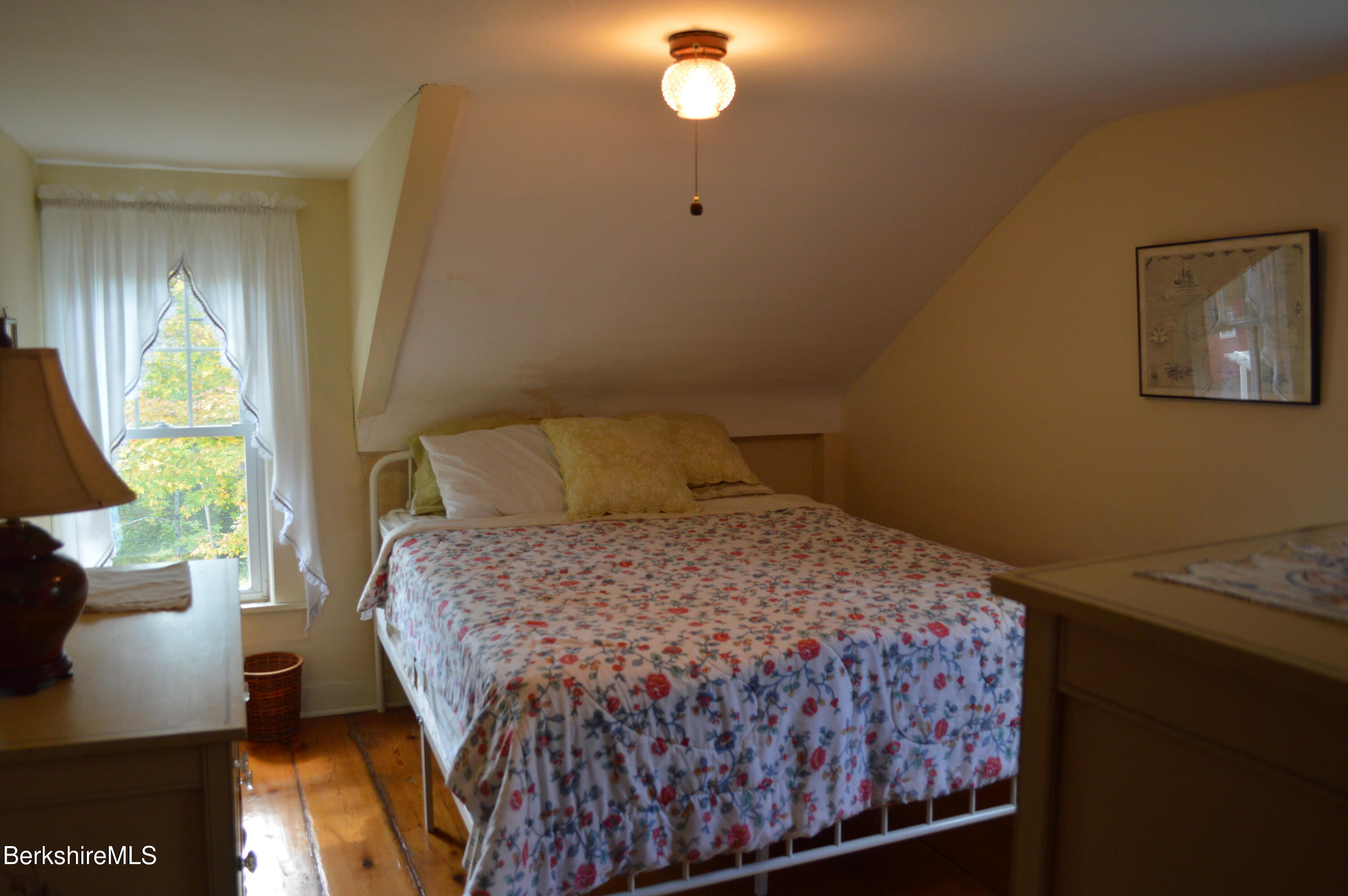 234 County Road Becket, MA 01223 - Photo 36 of 67 a bedroom with a bed and a window