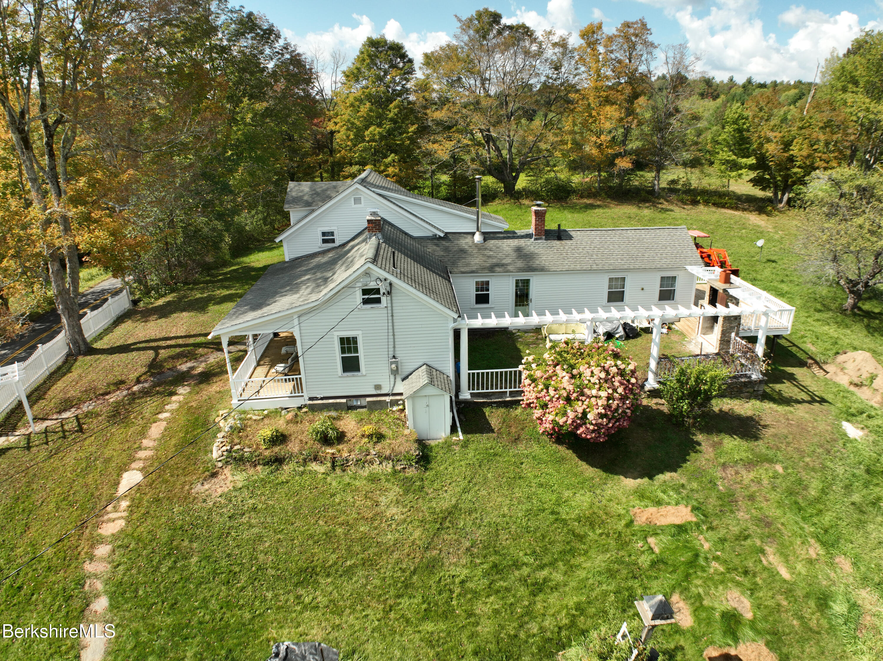 234 County Road Becket, MA 01223 - Photo 10 of 67 a view of a house with a big yard and large trees