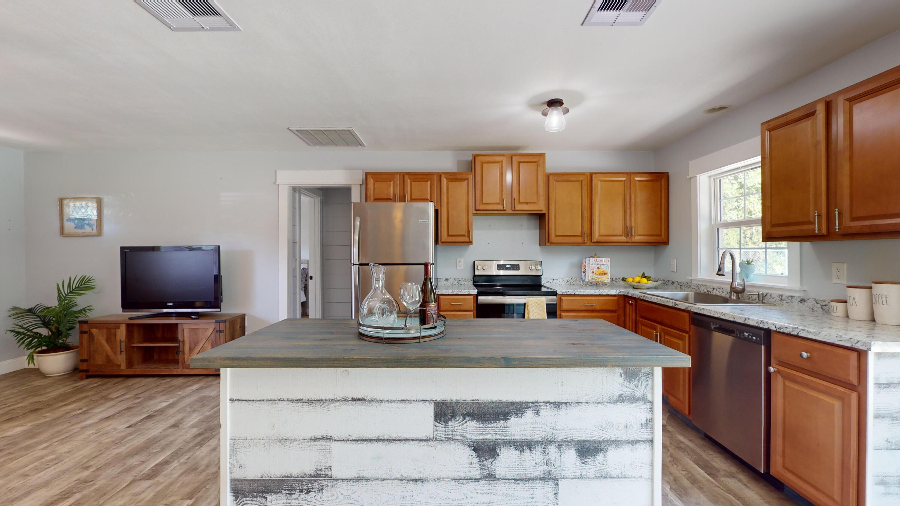 7606 Donlon Road Fort Pierce, FL 34951 - Photo 12 of 54 a kitchen with appliances a sink cabinets and a window