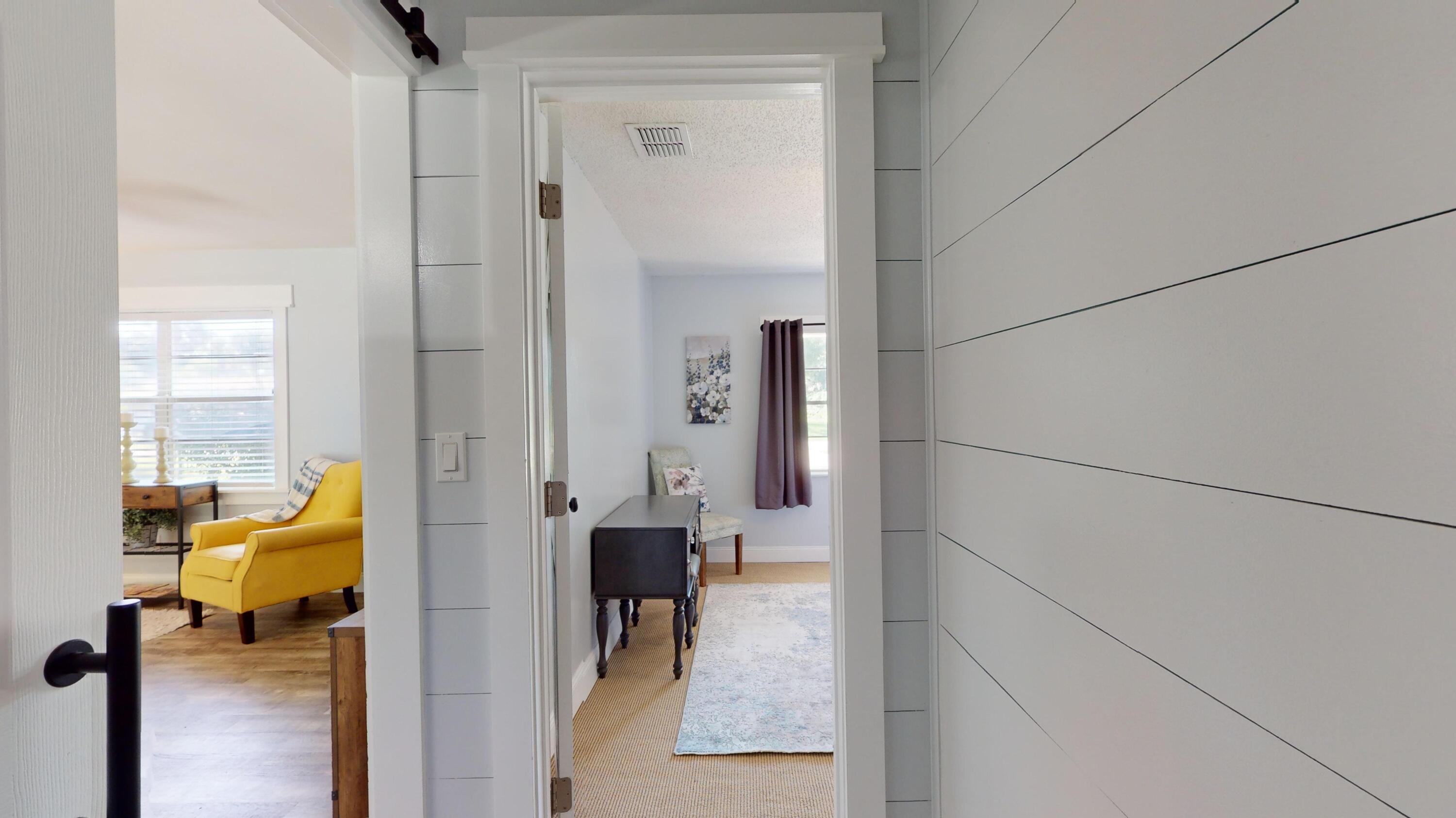 7606 Donlon Road Fort Pierce, FL 34951 - Photo 20 of 54 a en suite bathroom with a tub shower and a mirror