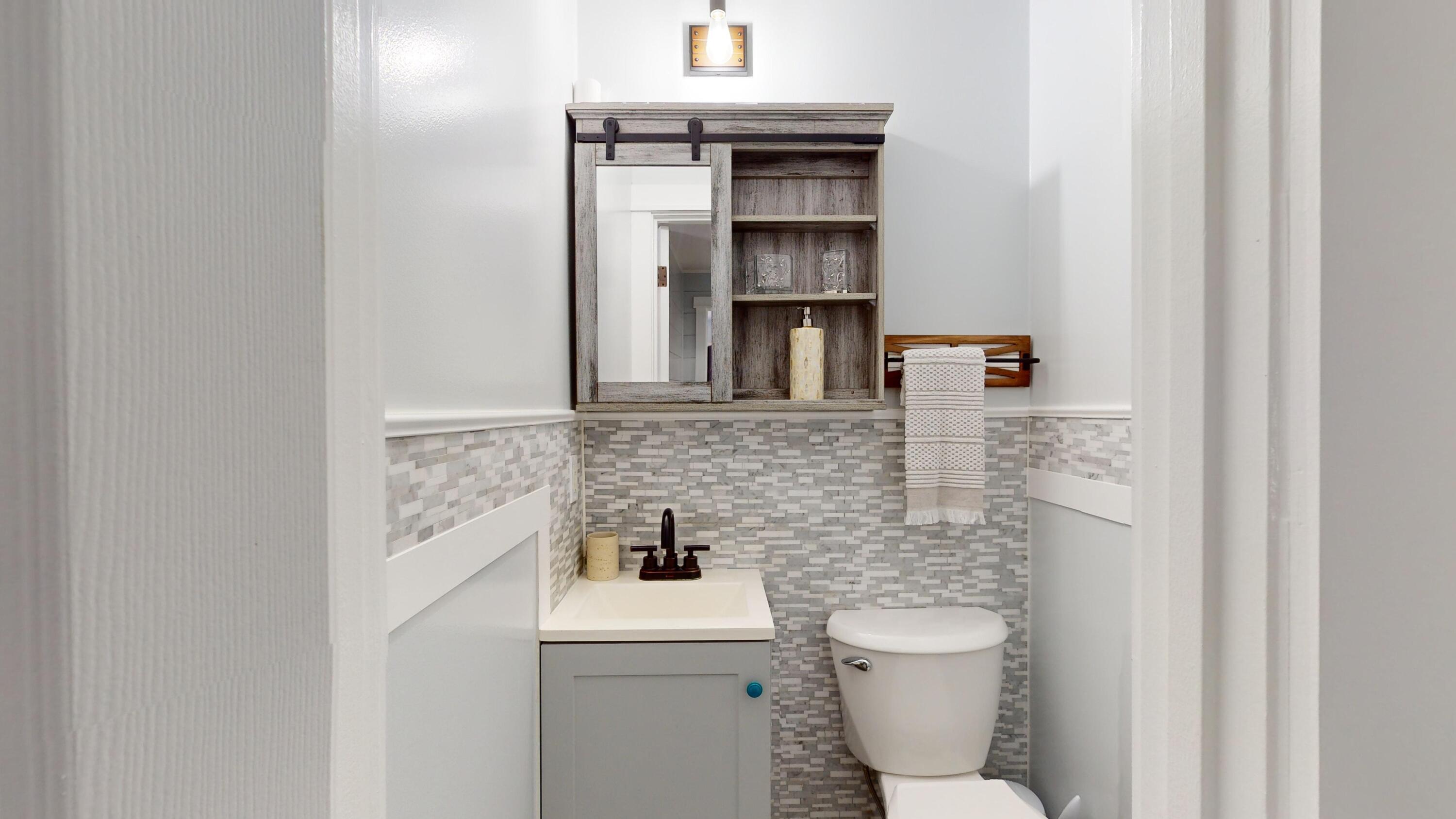 7606 Donlon Road Fort Pierce, FL 34951 - Photo 23 of 54 a bathroom with a toilet and a sink