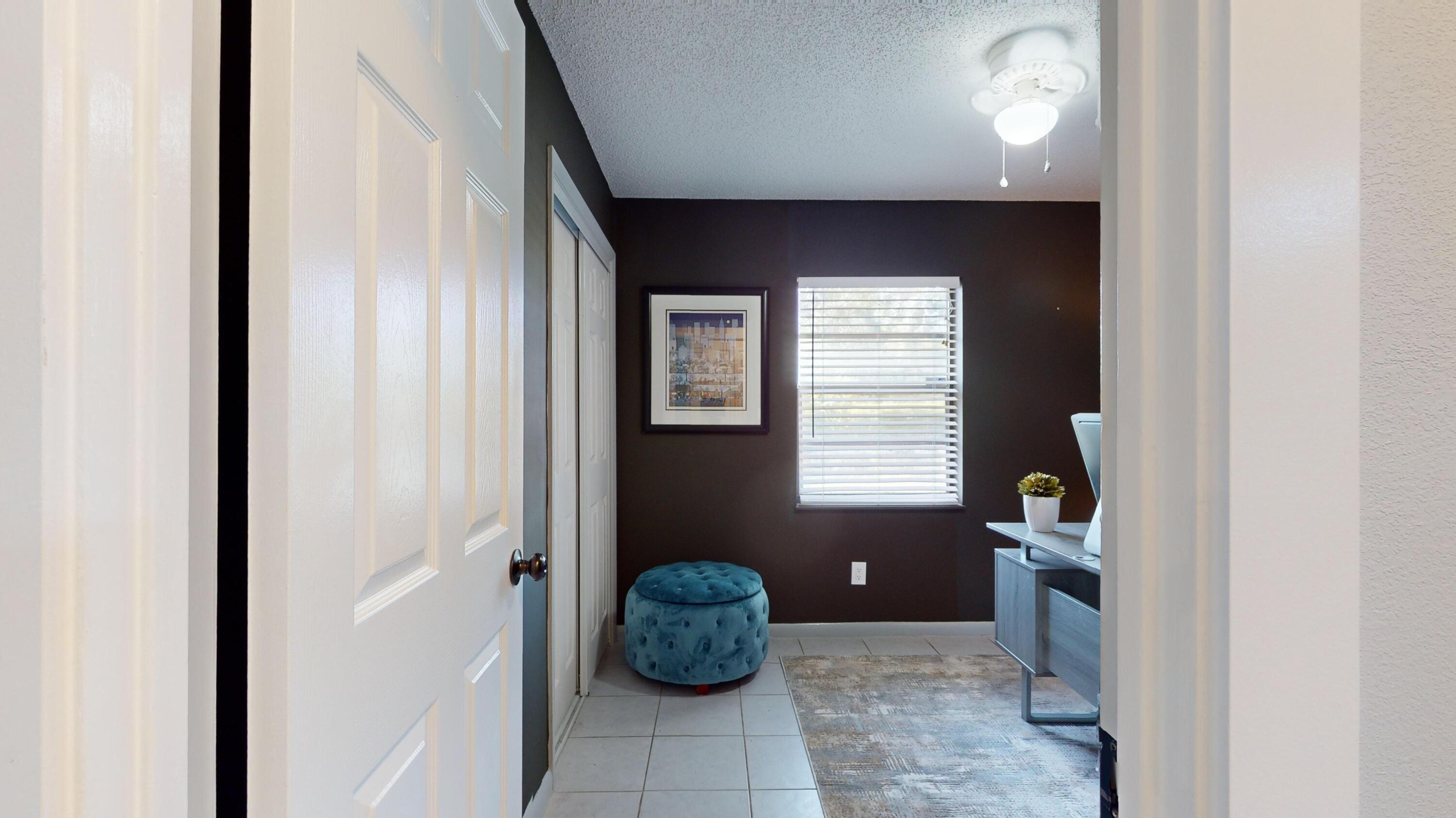 7606 Donlon Road Fort Pierce, FL 34951 - Photo 28 of 54 a bathroom with a tub and window