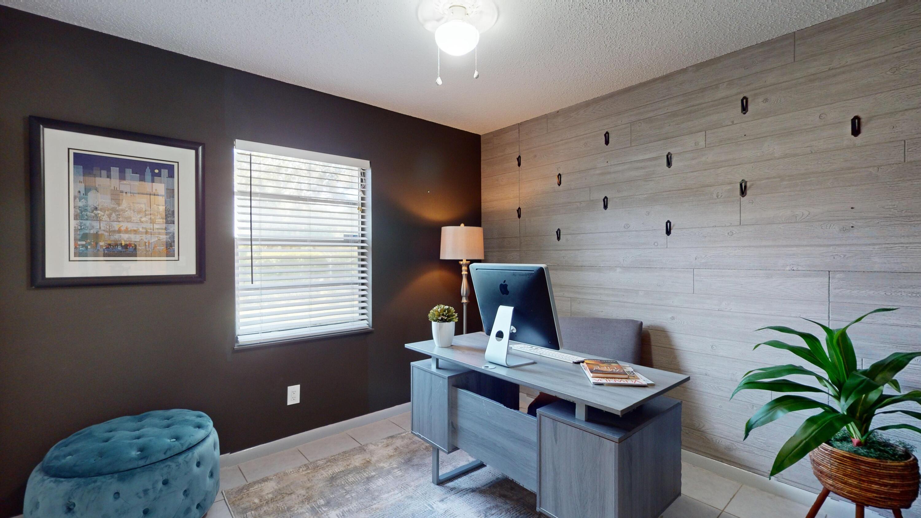 7606 Donlon Road Fort Pierce, FL 34951 - Photo 29 of 54 a view of a workspace with furniture and a window