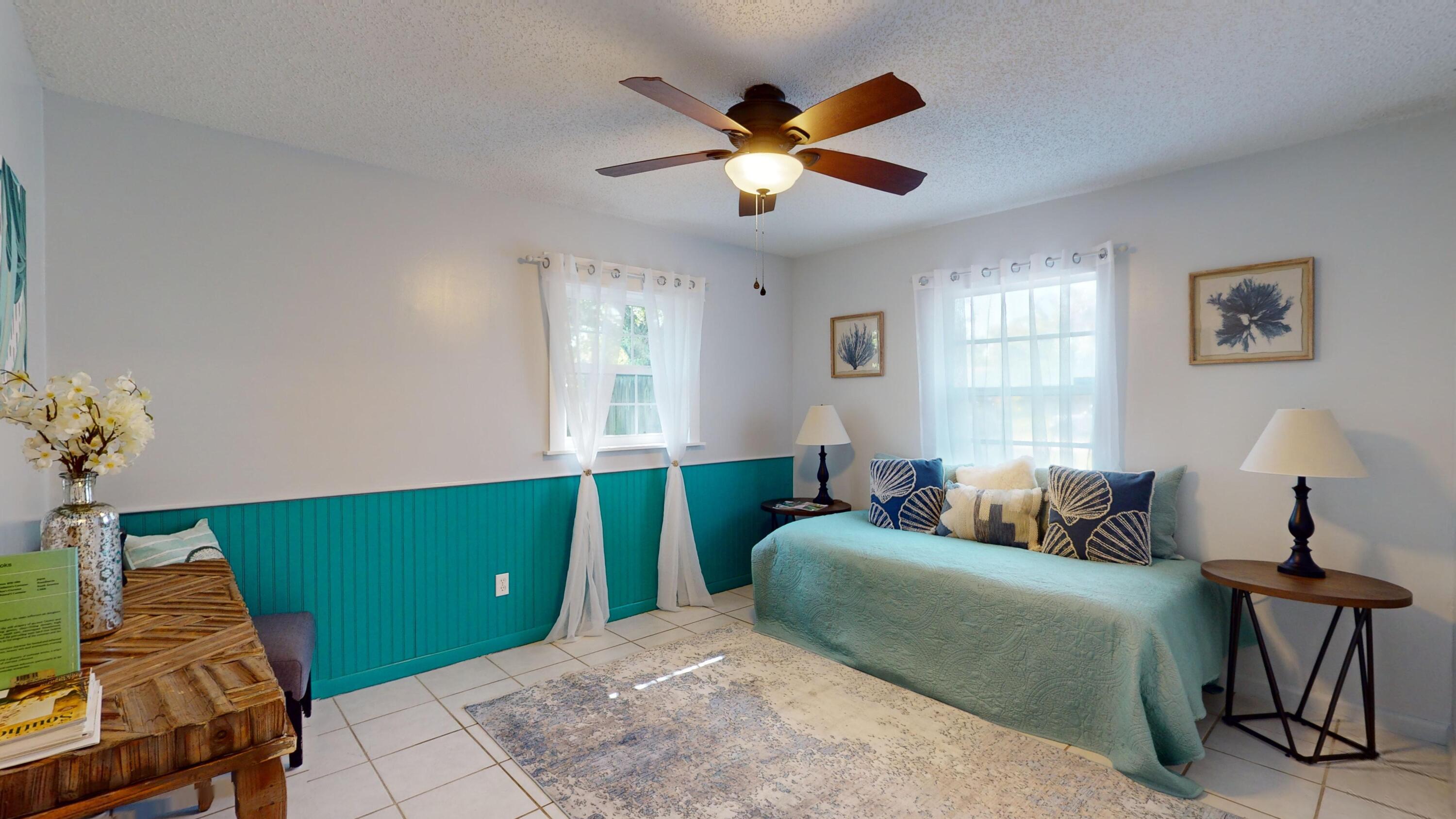 7606 Donlon Road Fort Pierce, FL 34951 - Photo 38 of 54 a bedroom with a bed and a window