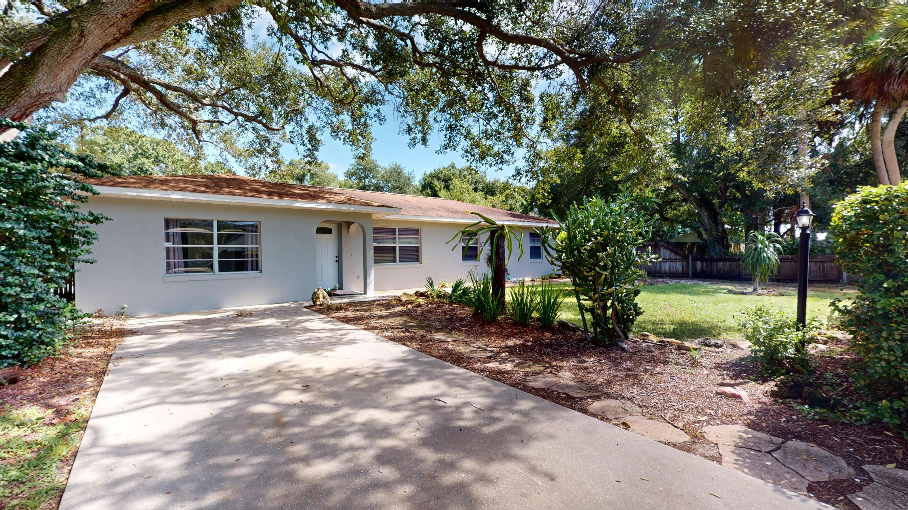 7606 Donlon Road Fort Pierce, FL 34951 - Photo 44 of 54 a view of a house with a yard