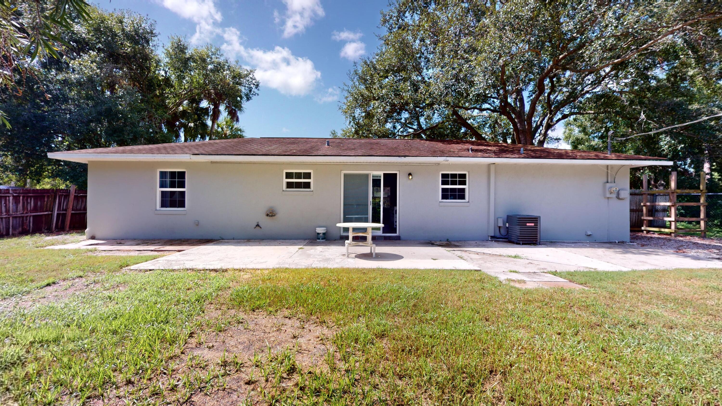 7606 Donlon Road Fort Pierce, FL 34951 - Photo 46 of 54 a house view with swimming pool in front of it