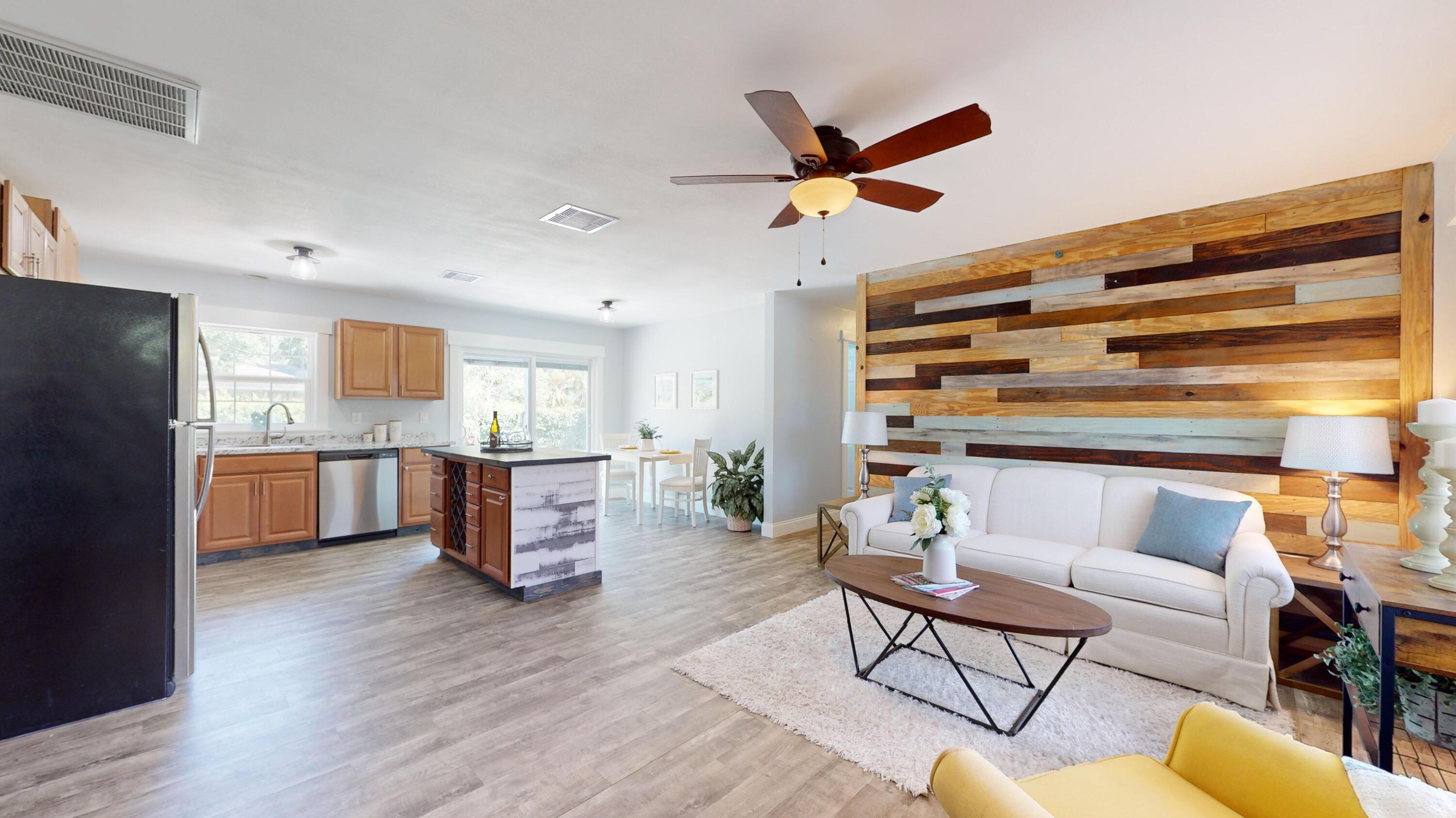 7606 Donlon Road Fort Pierce, FL 34951 - Photo 5 of 54 a living room with furniture and kitchen view