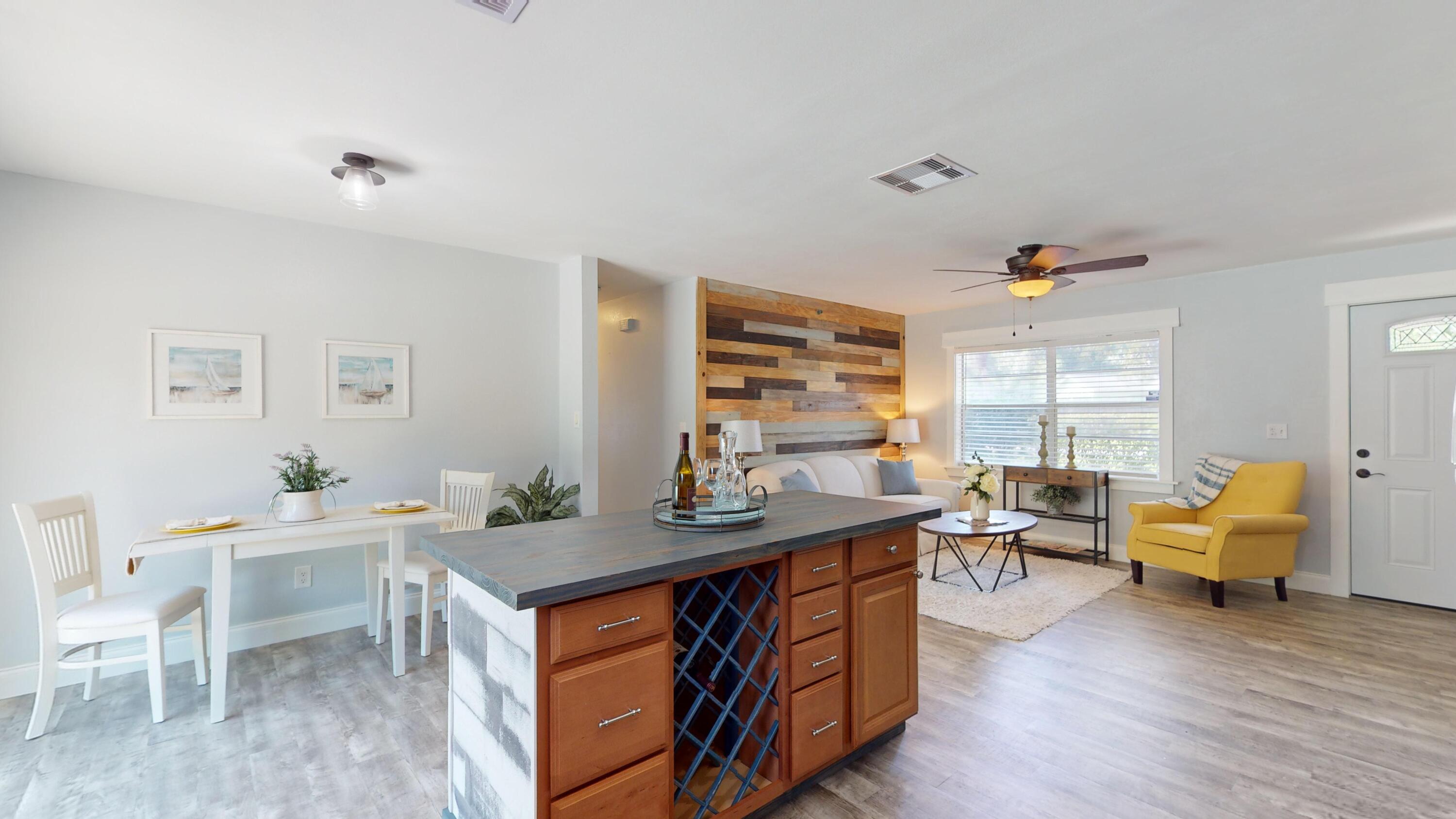 7606 Donlon Road Fort Pierce, FL 34951 - Photo 8 of 54 a room with a wooden floor and furniture
