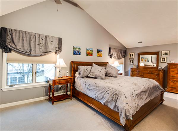 20 William Street Needham, MA 02494 - Photo 11 of 16 a spacious bedroom with a bed a dresser and large windows