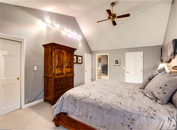 20 William Street Needham, MA 02494 - Photo 12 of 16 a bedroom with a bed and a chandelier