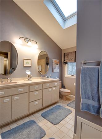 20 William Street Needham, MA 02494 - Photo 13 of 16 a bathroom with a double vanity sink a mirror and a toilet