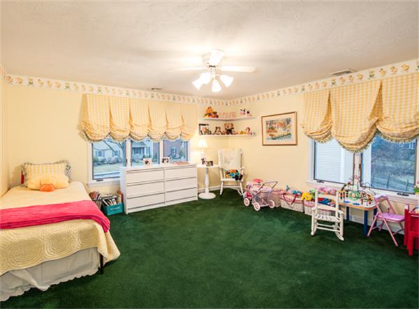 20 William Street Needham, MA 02494 - Photo 15 of 16 a bedroom with furniture and a baby crib