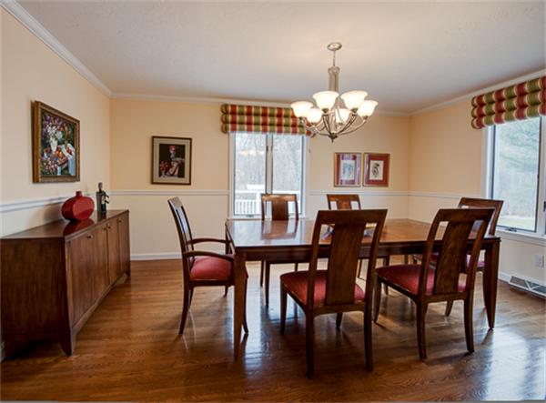 20 William Street Needham, MA 02494 - Photo 7 of 16 a view of a dining room with furniture wooden floor and chandelier