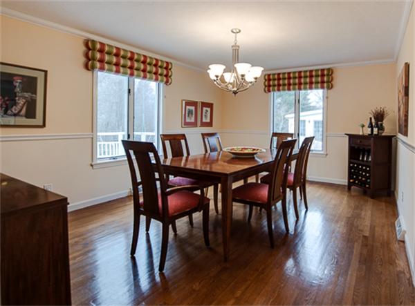 20 William Street Needham, MA 02494 - Photo 8 of 16 a view of a dining room with furniture wooden floor and chandelier