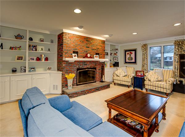 20 William Street Needham, MA 02494 - Photo 9 of 16 a living room with furniture pool table and a fireplace