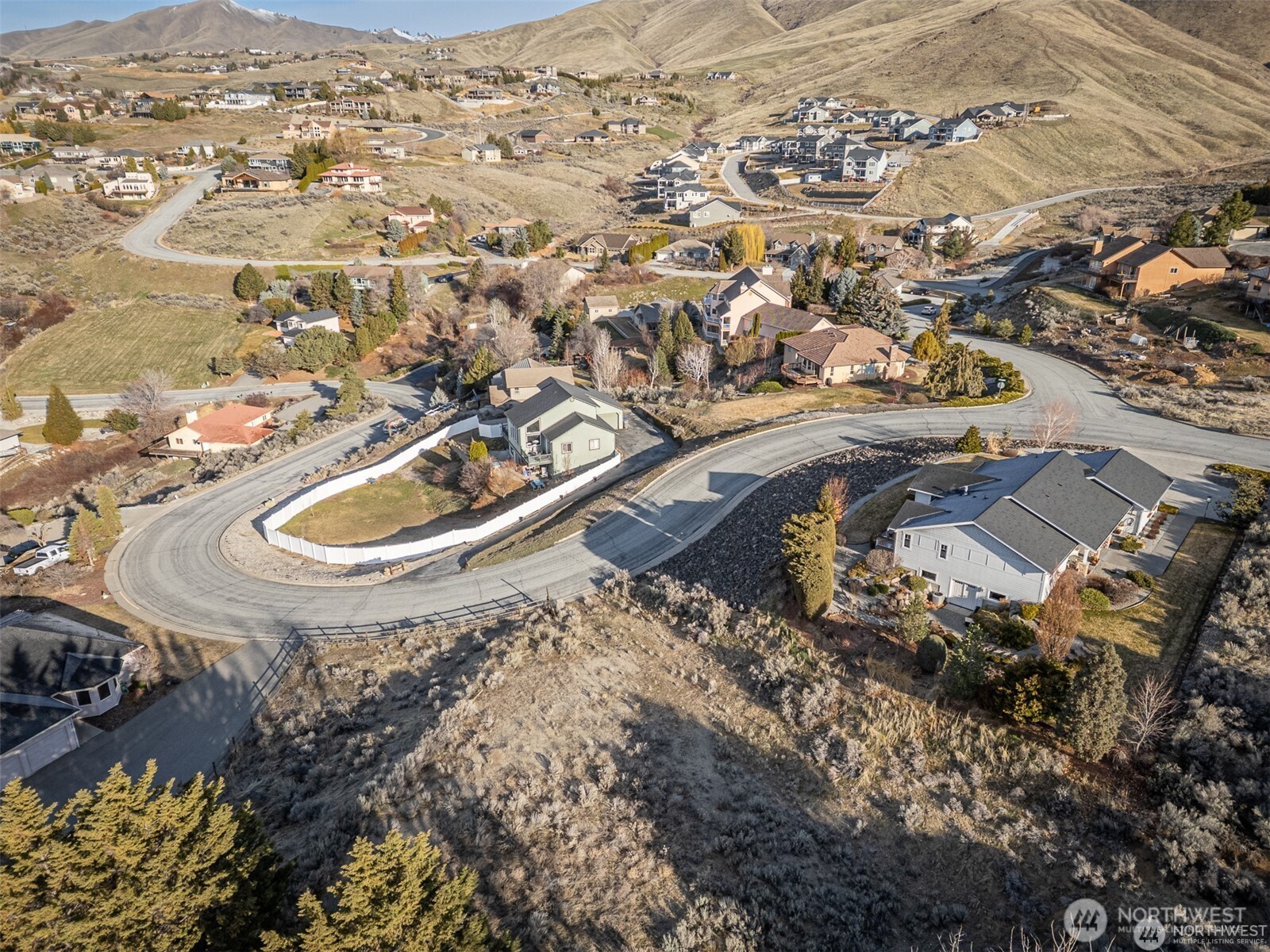 155 Stoney Brook Lane Wenatchee, WA 98801 - Photo 6 of 16 an aerial view of a house with a mountain