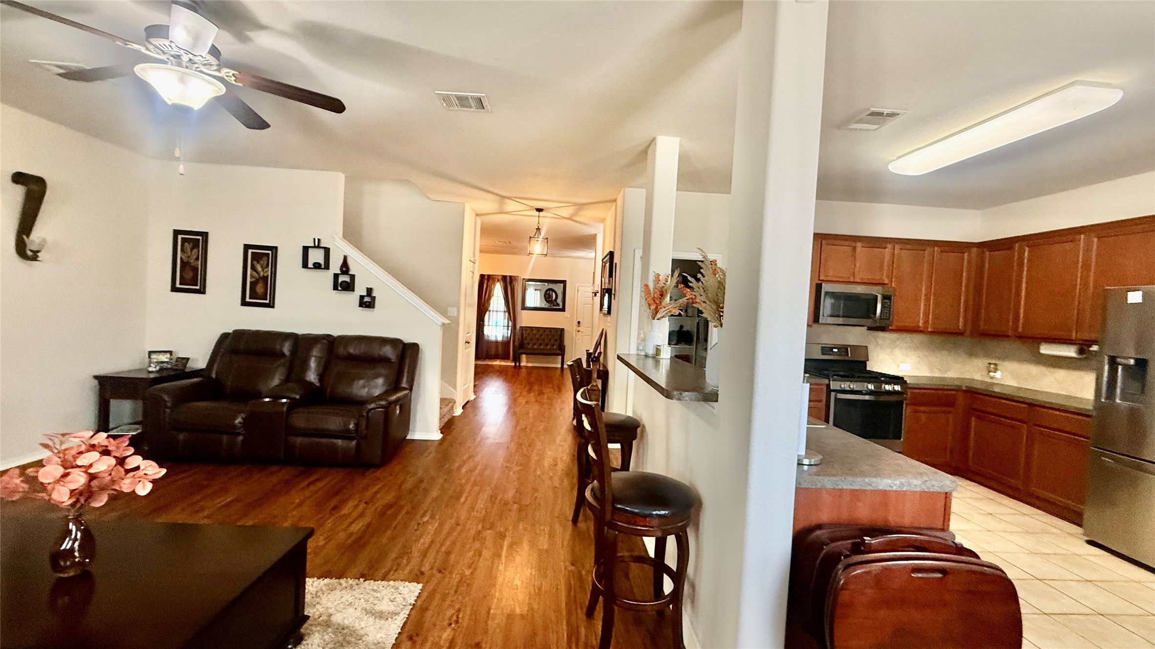 18309 Wind Tree Lane Elgin, TX 78621 - Photo 29 of 29 An open floor plan connects the comfortable living area directly to the kitchen.