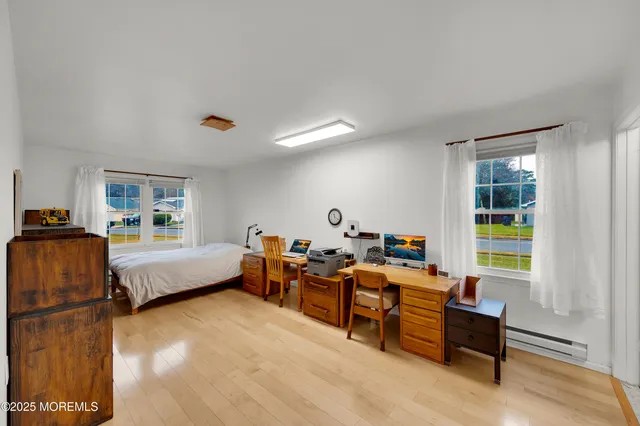 a bed room with furniture and a window