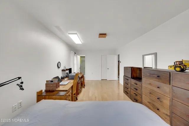 a bedroom with a bed and furniture