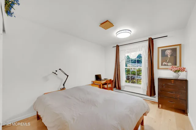 a bedroom with a bed and a dresser