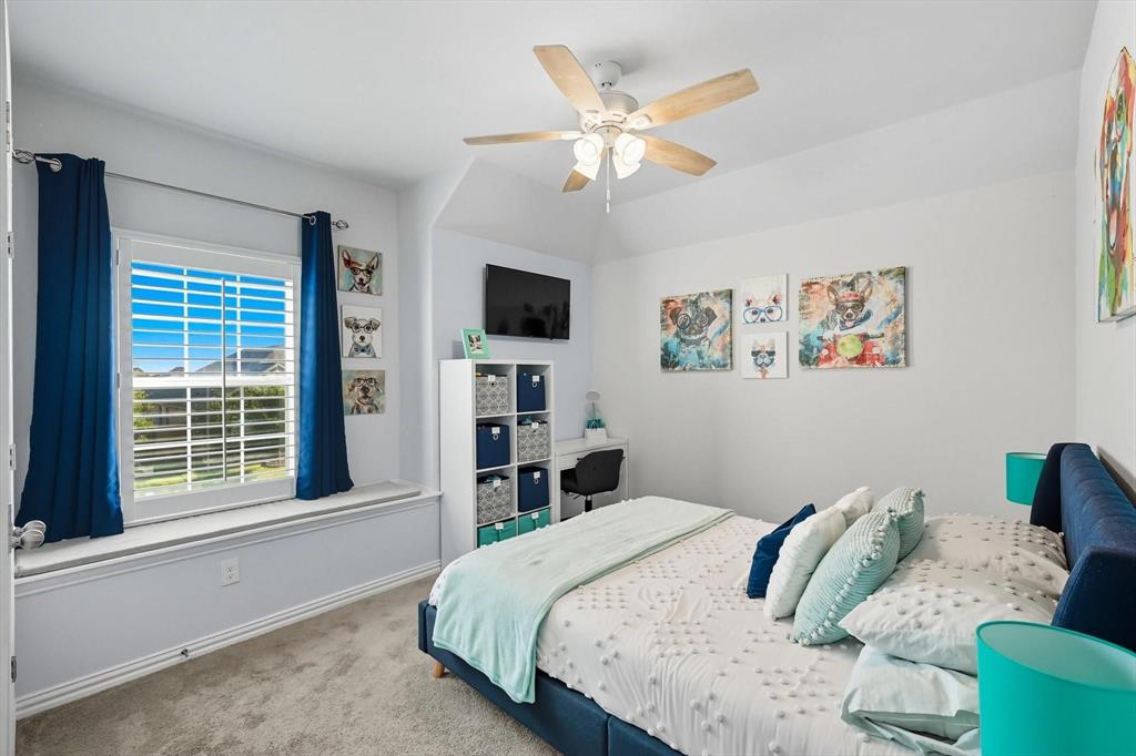 1724 Wassel Road Fort Worth, TX 76052 - Photo 21 of 24 Carpeted room featuring a ceiling fan with light fixture, window with plantation shutters, window bench, and an alcove for a desk or storage