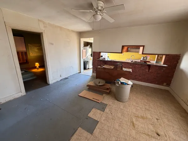 a room with furniture and a lamp