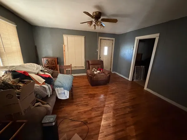 a bedroom with furniture and a chandelier