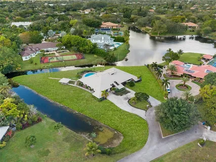 an aerial view of a house with a lake view