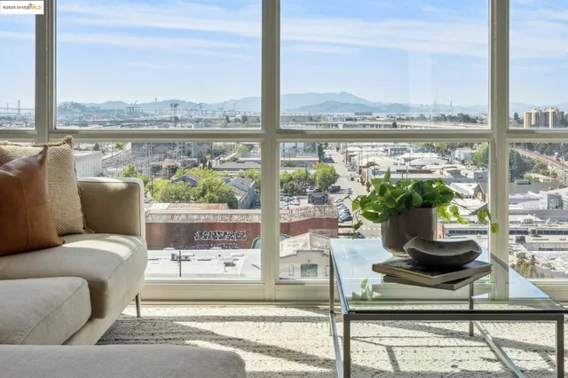 a living room with a floor to ceiling window and a floor to ceiling window