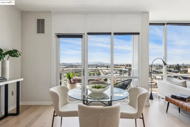 a view of a chairs and table in the balcony