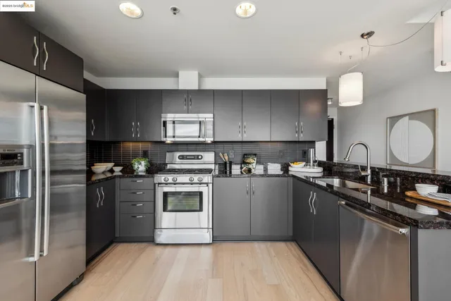 a view of a storage and utility room with washer and dryer